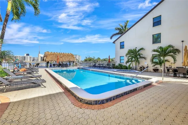 a view of a swimming pool with lounge chair