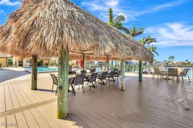 a view of a swimming pool with sitting area