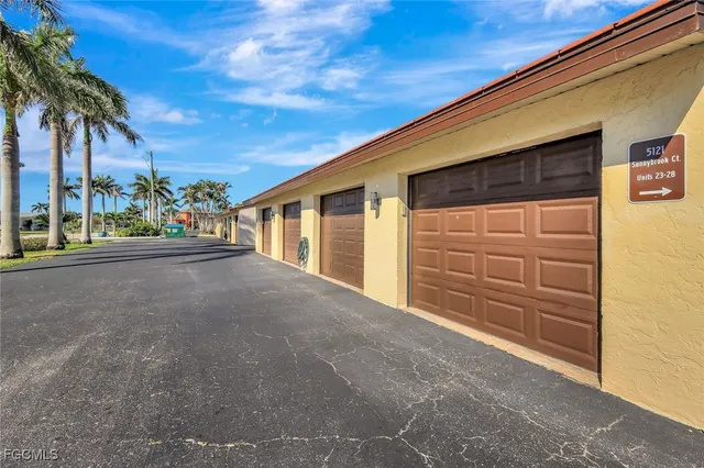 a sign that is sitting in front of house