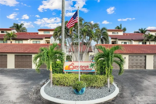 a view of multiple houses with yard
