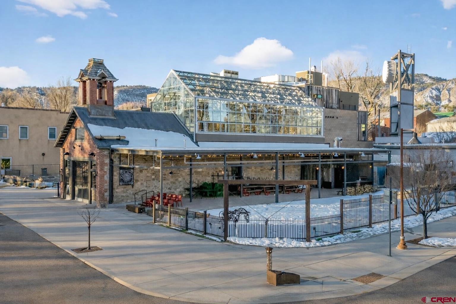 185 North Lena Street, Unit CONDO B Ridgway, CO 81432 - Photo 2 of 5 a tall building on the side of a street