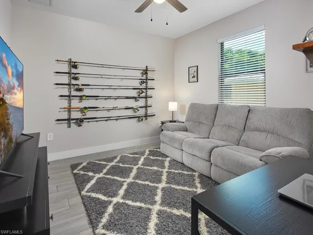 a living room with furniture and a window