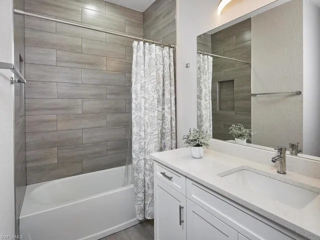 a bathroom with a bathtub and a sink