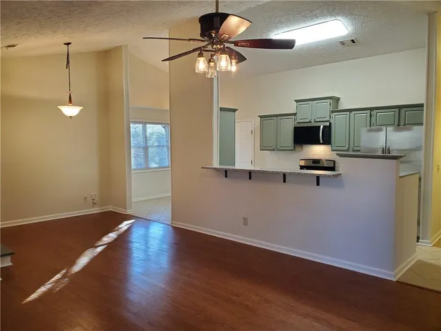 a view of livingroom with furniture and wooden floor