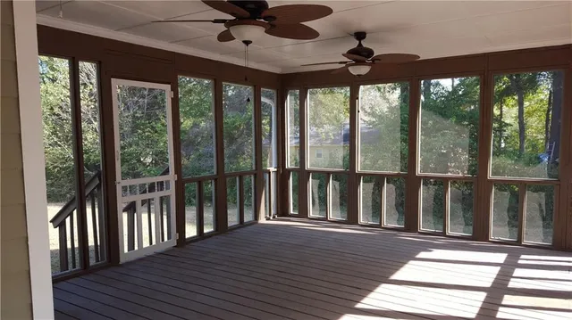 a view of a porch with wooden floor and balcony