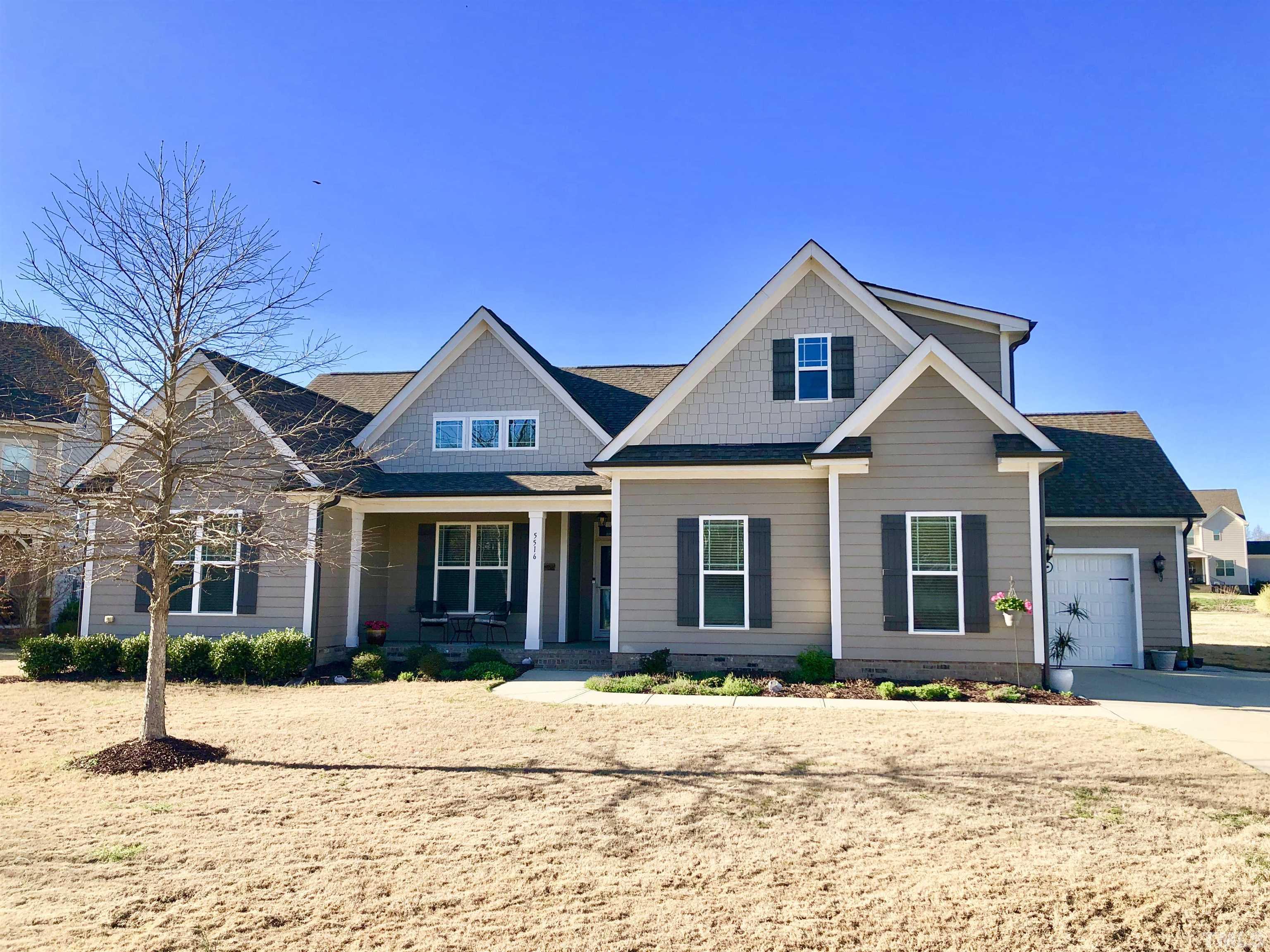 5516 Red Line Court Raleigh, NC 27603 - Photo 1 of 39 a front view of a house with a yard