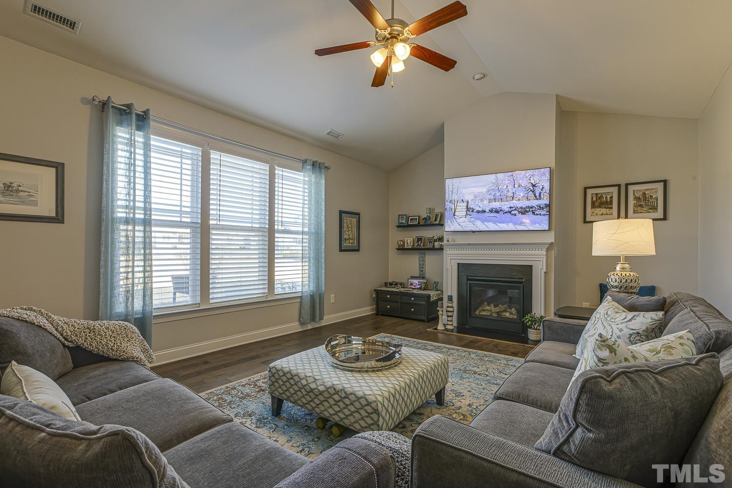 5516 Red Line Court Raleigh, NC 27603 - Photo 12 of 39 a living room with furniture and a fireplace