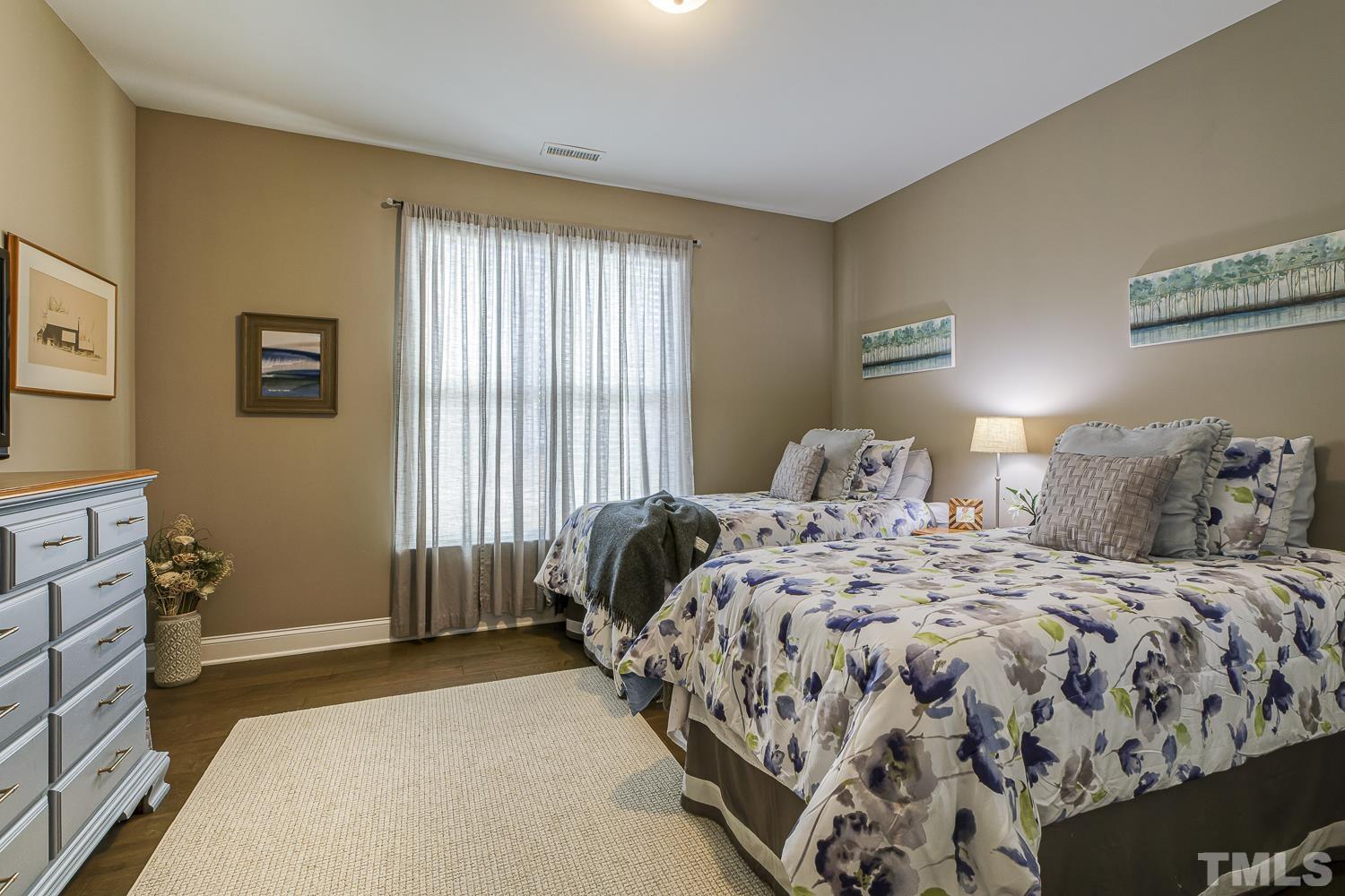 5516 Red Line Court Raleigh, NC 27603 - Photo 22 of 39 a bedroom with a bed and a window