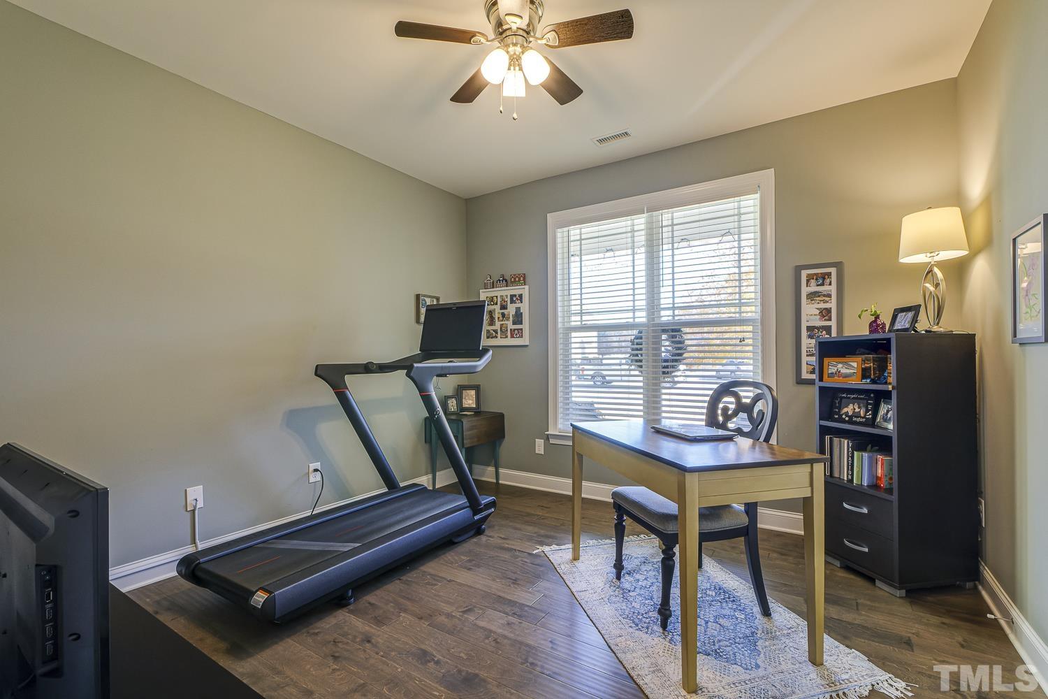 5516 Red Line Court Raleigh, NC 27603 - Photo 25 of 39 a view of a workspace with furniture and a window