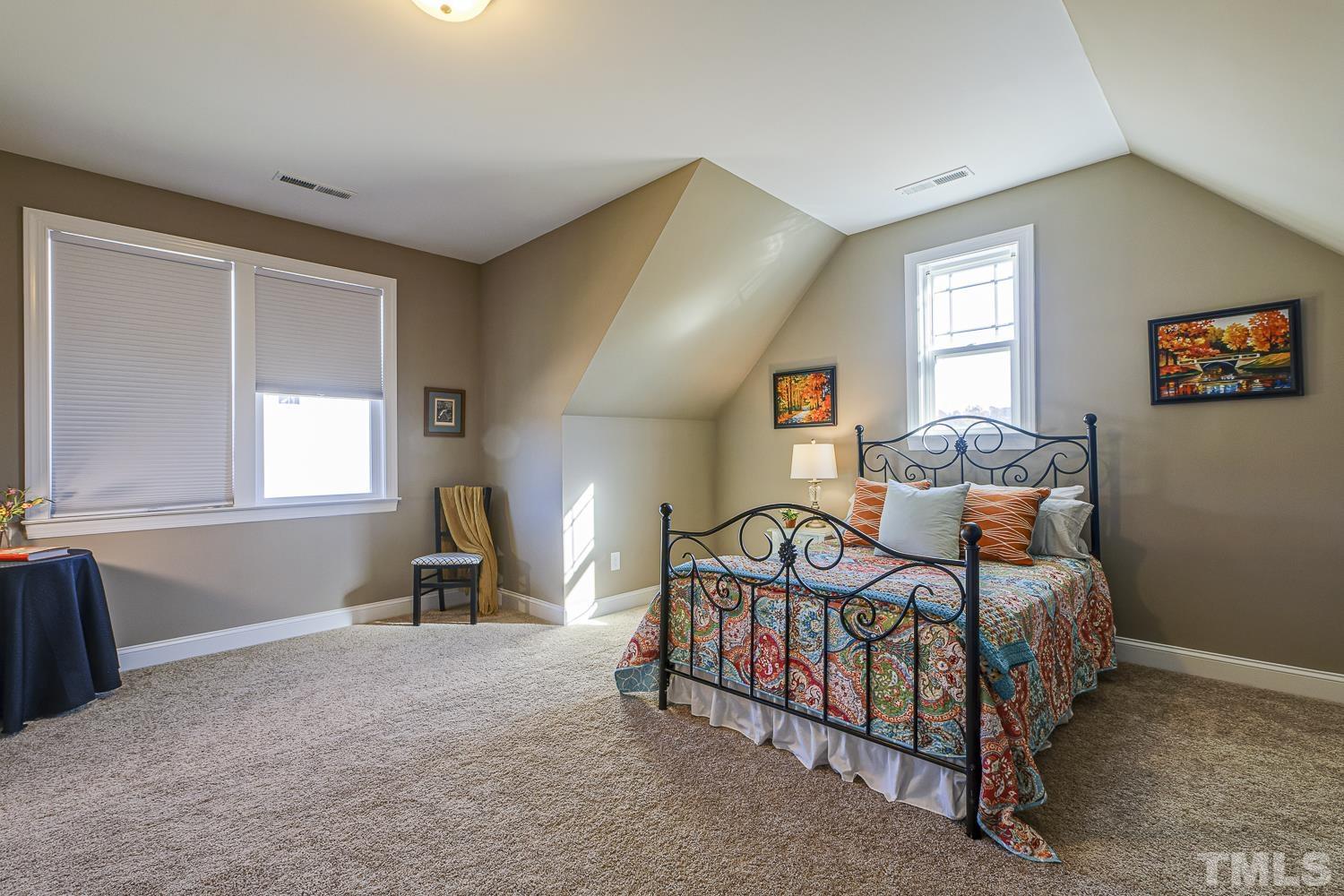 5516 Red Line Court Raleigh, NC 27603 - Photo 27 of 39 a bedroom with bed and a window