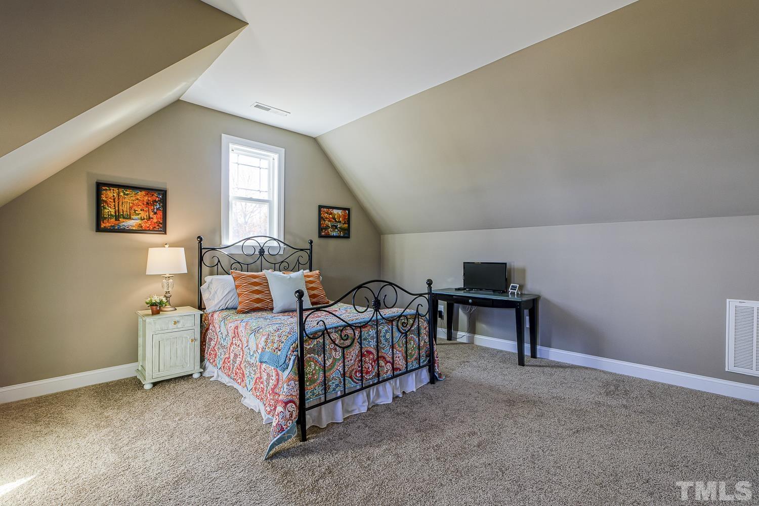 5516 Red Line Court Raleigh, NC 27603 - Photo 29 of 39 a bed room with furniture and a window