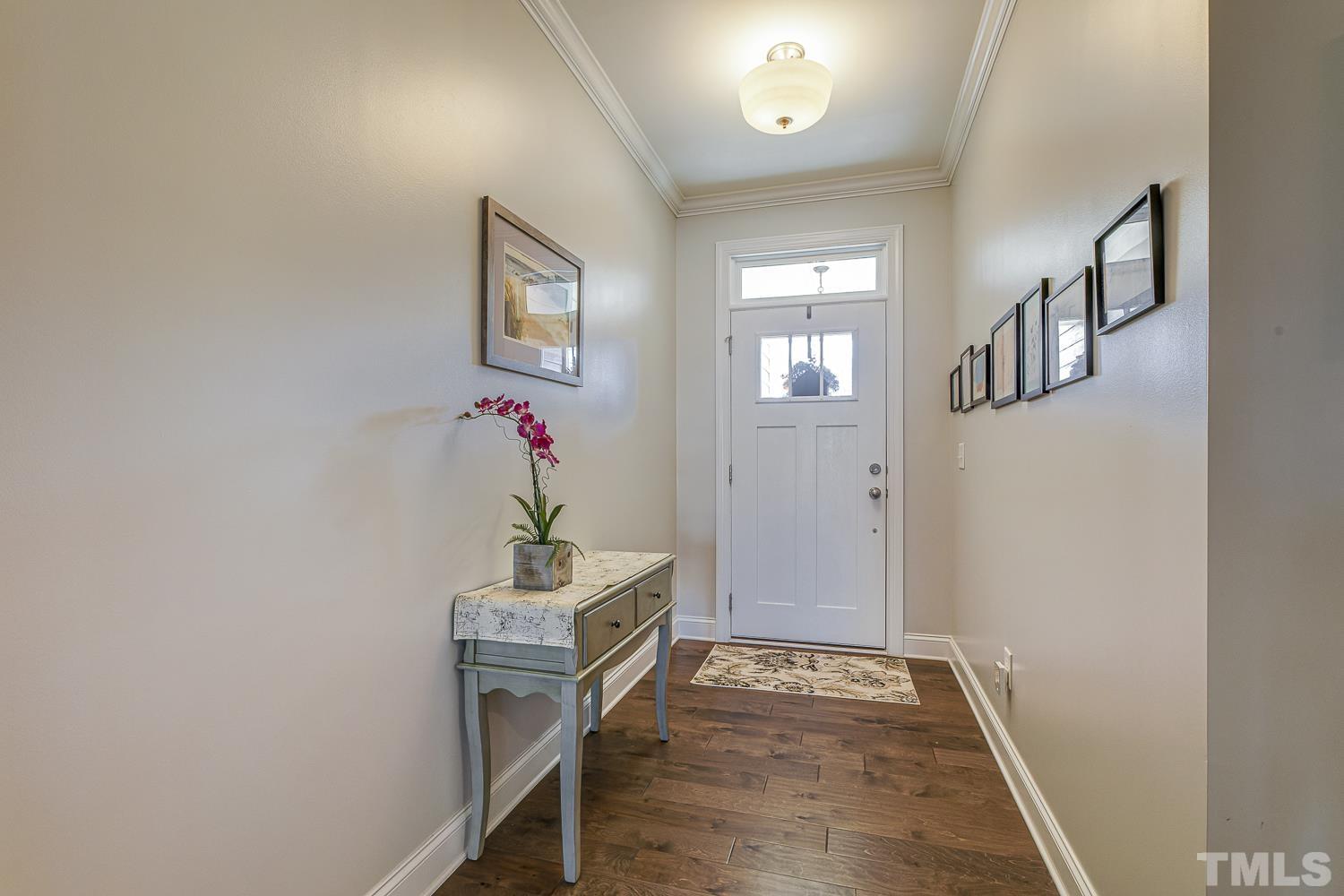 5516 Red Line Court Raleigh, NC 27603 - Photo 3 of 39 a view of an entryway with wooden floor