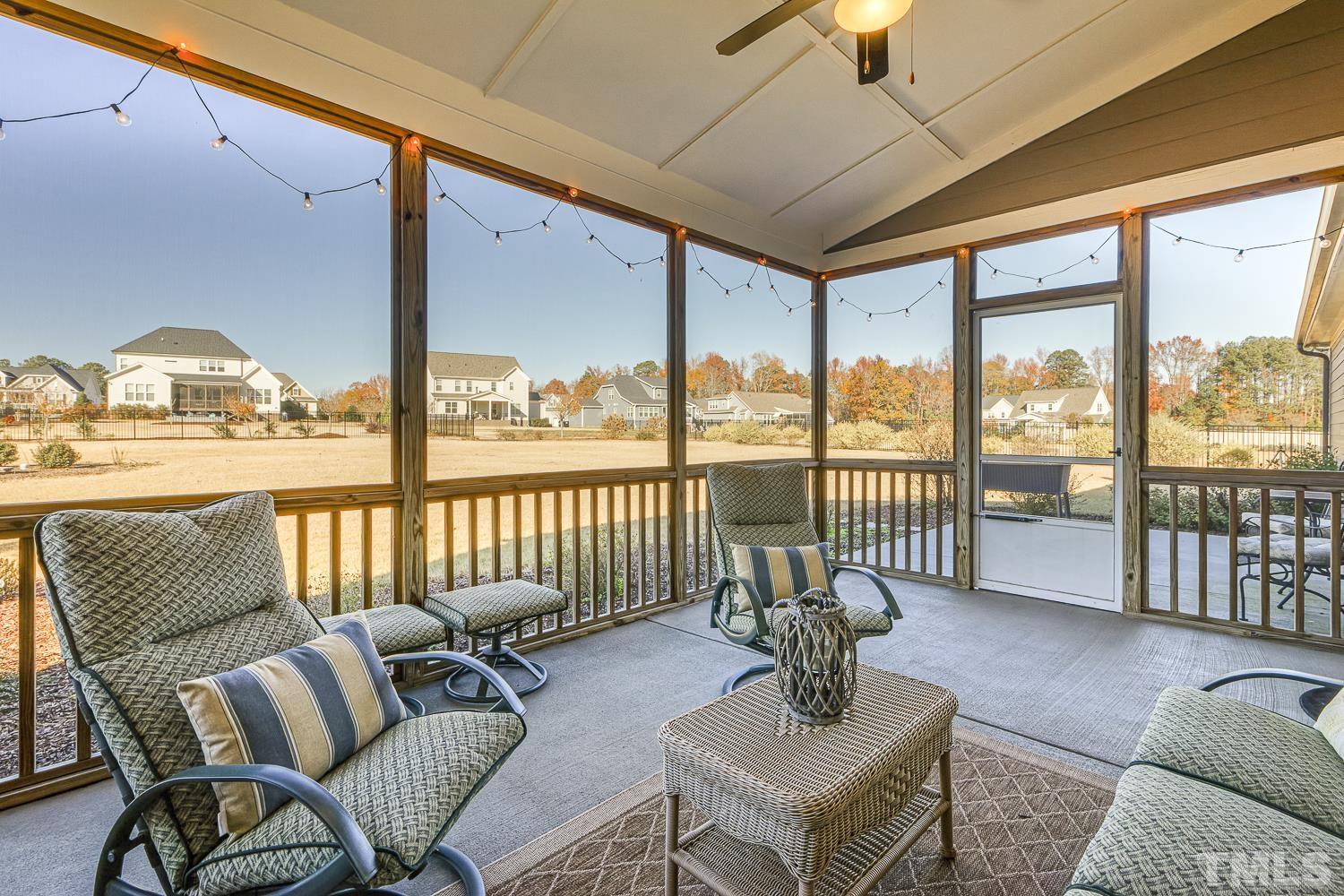 5516 Red Line Court Raleigh, NC 27603 - Photo 31 of 39 a living room with furniture and a floor to ceiling window