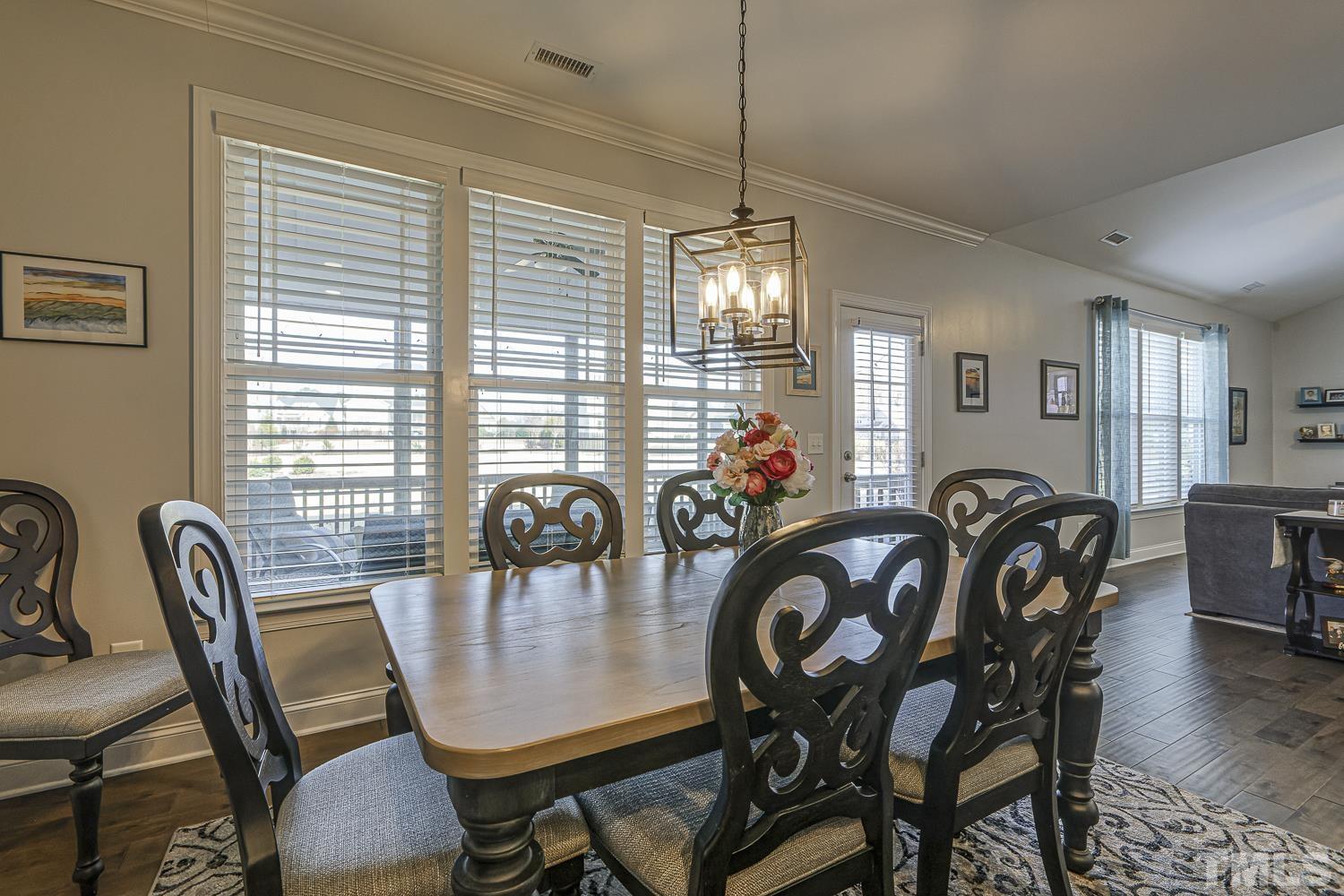 5516 Red Line Court Raleigh, NC 27603 - Photo 9 of 39 a view of a dining room with furniture and chandelier