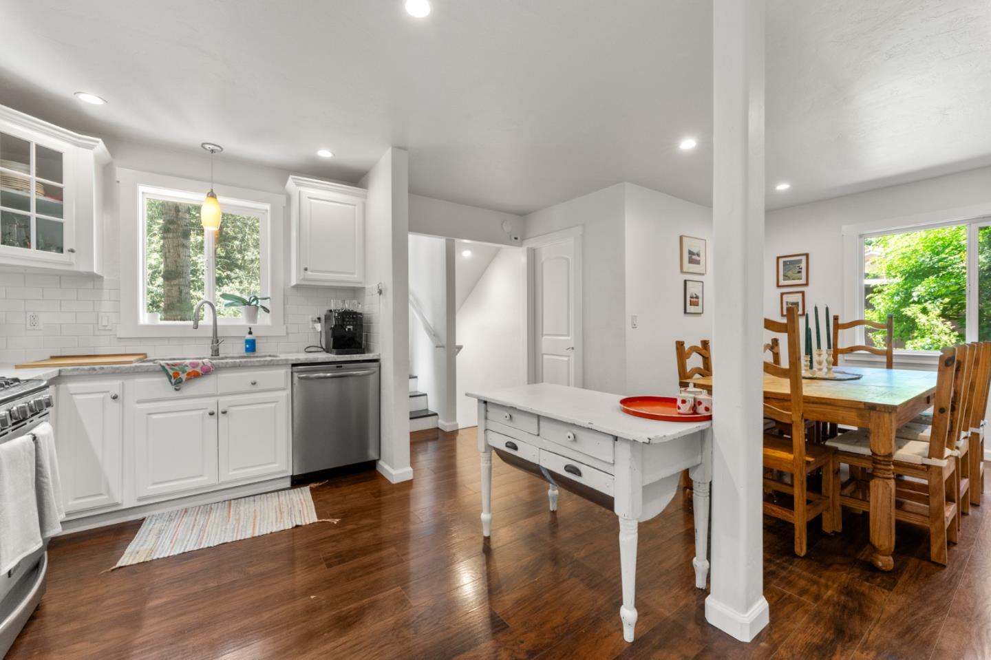 140 Baker Road Aptos, CA 95003 - Photo 13 of 62 a kitchen with stainless steel appliances kitchen island granite countertop a stove a sink a refrigerator and white cabinets with wooden floor