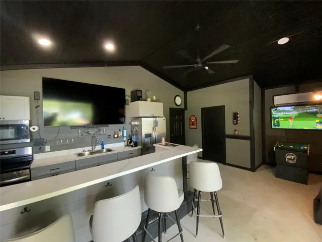 a room with furniture and a flat screen tv