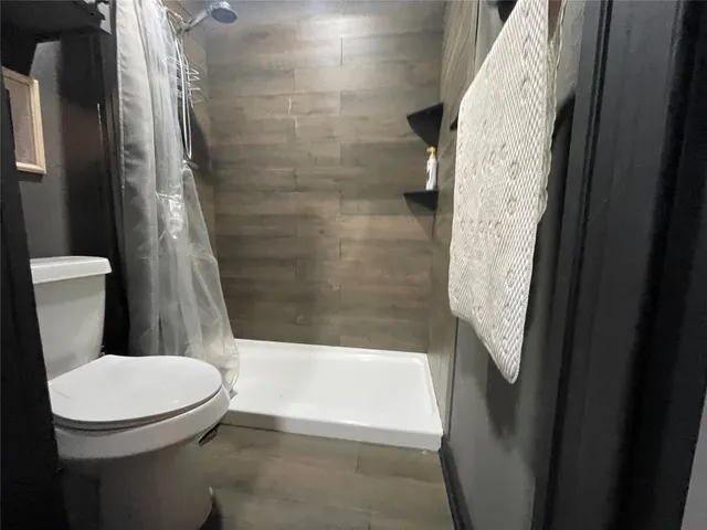 a bedroom with a bed and a mirror