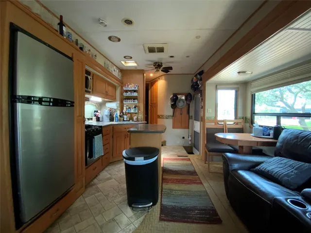 a living room with a couch and a large window