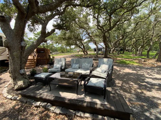 a view of green field with trees