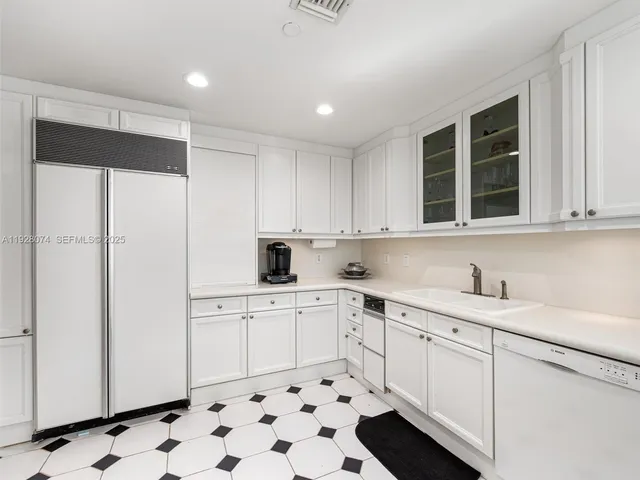 a kitchen with appliances cabinets and a sink