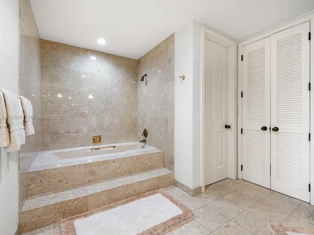 a bedroom with bed and window