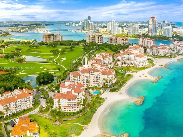 a view of a lake with houses in the back