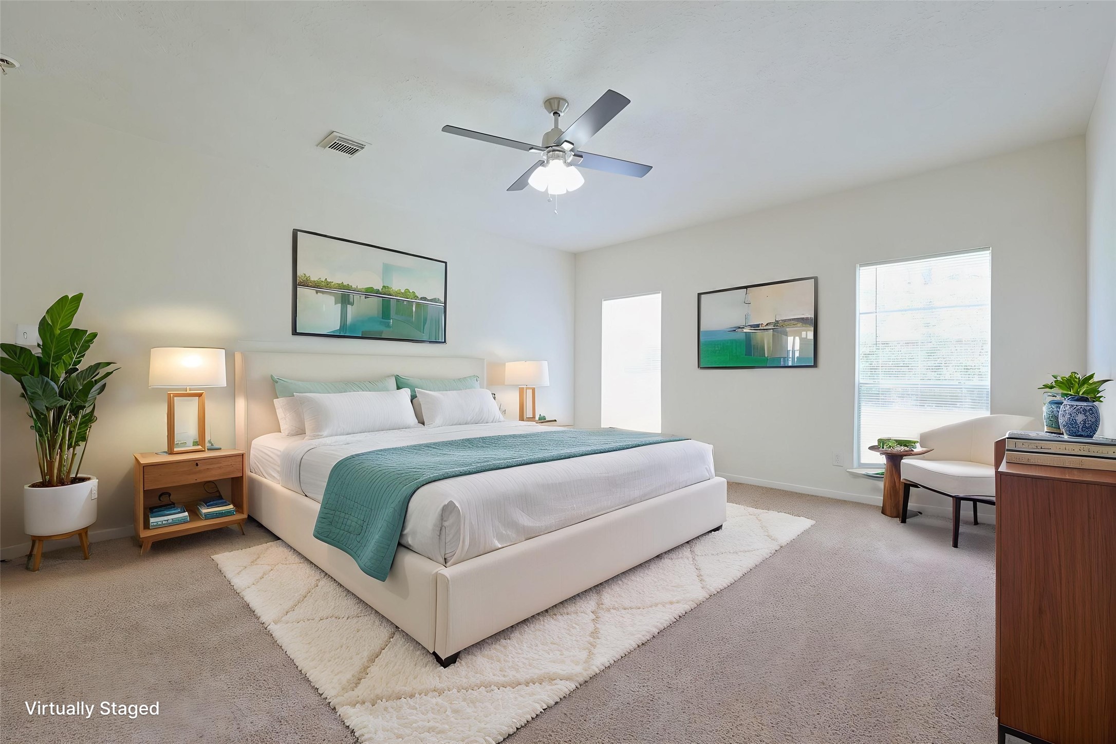 23019 Eastgate Village Drive Spring, TX 77373 - Photo 22 of 46 Primary bedroom is spacious. It has ample natural light from two windows, a ceiling fan, and neutral carpeting, creating a cozy and inviting space.