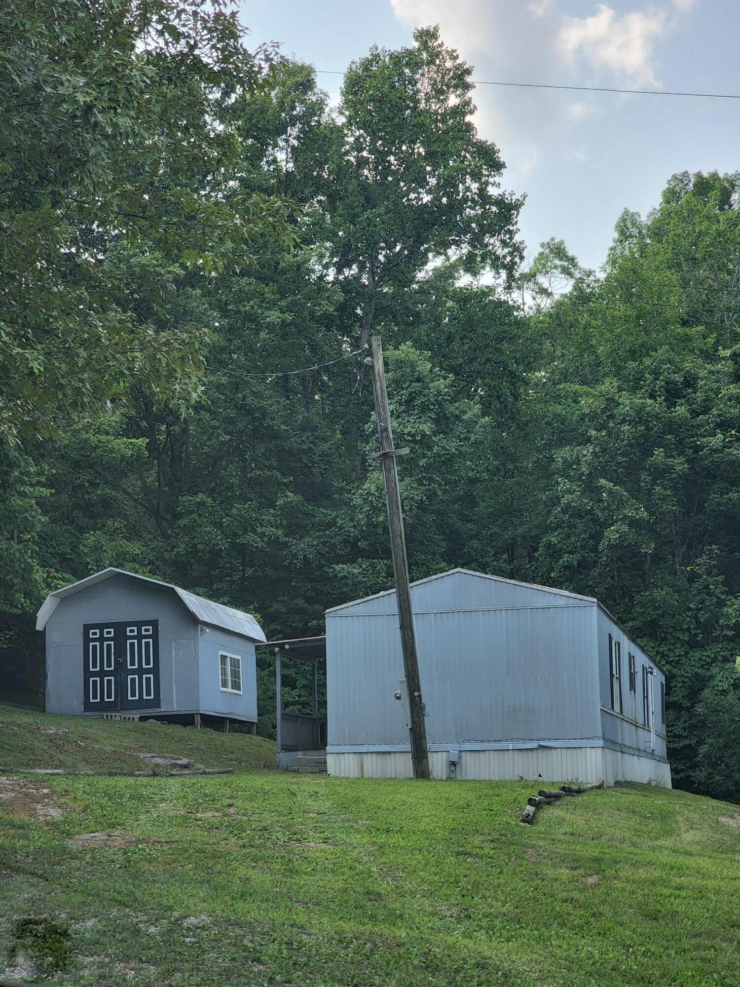 314 Wolf Gap Road Bronston, KY 42518 - Photo 1 of 10 20220723_162143