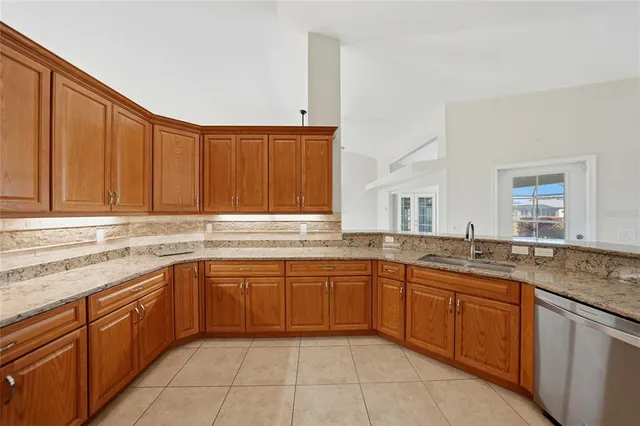 a view of a kitchen with a sink and dishwasher