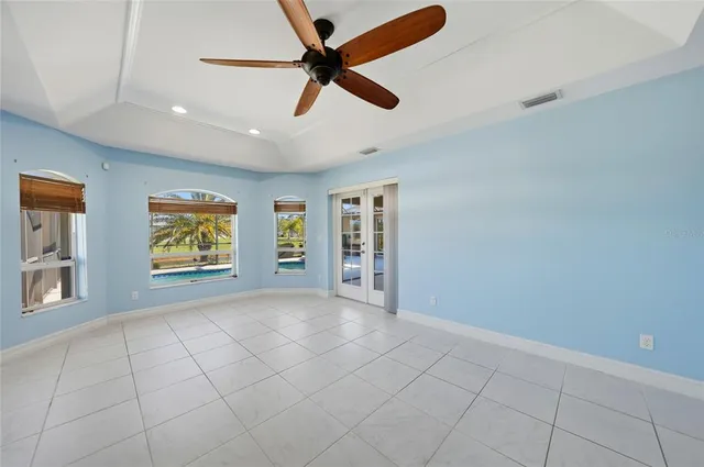 a large bathroom with a granite countertop sink mirror and a bathtub