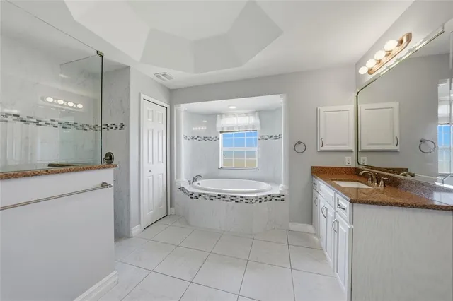 a bathroom with a shower and a sink