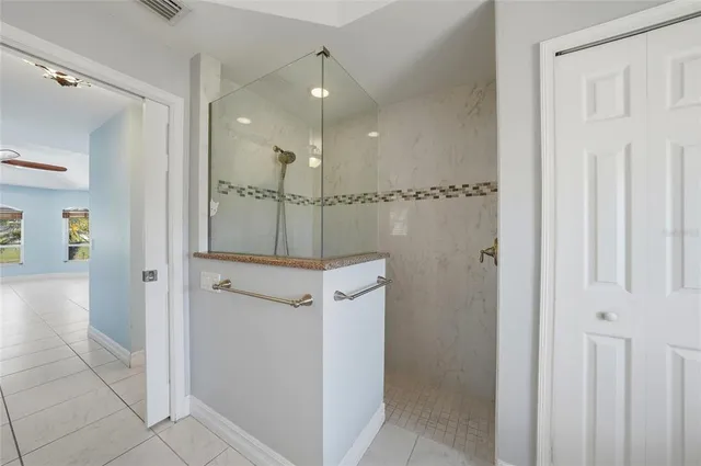 a view of a livingroom with a ceiling fan and window