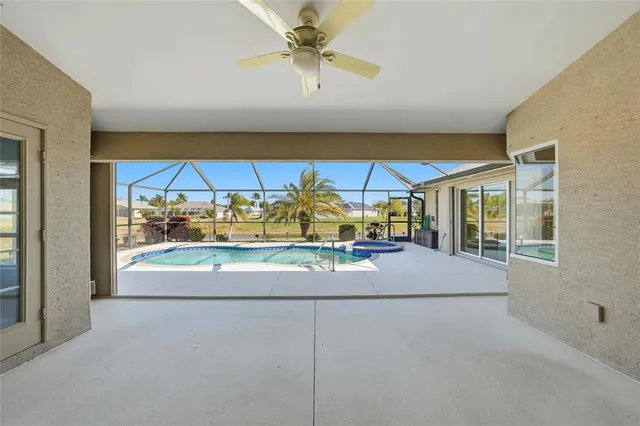 a view of swimming pool with seating area