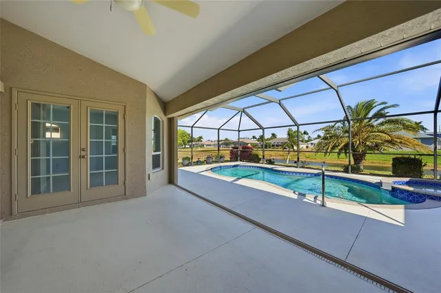 a view of a swimming pool with a patio