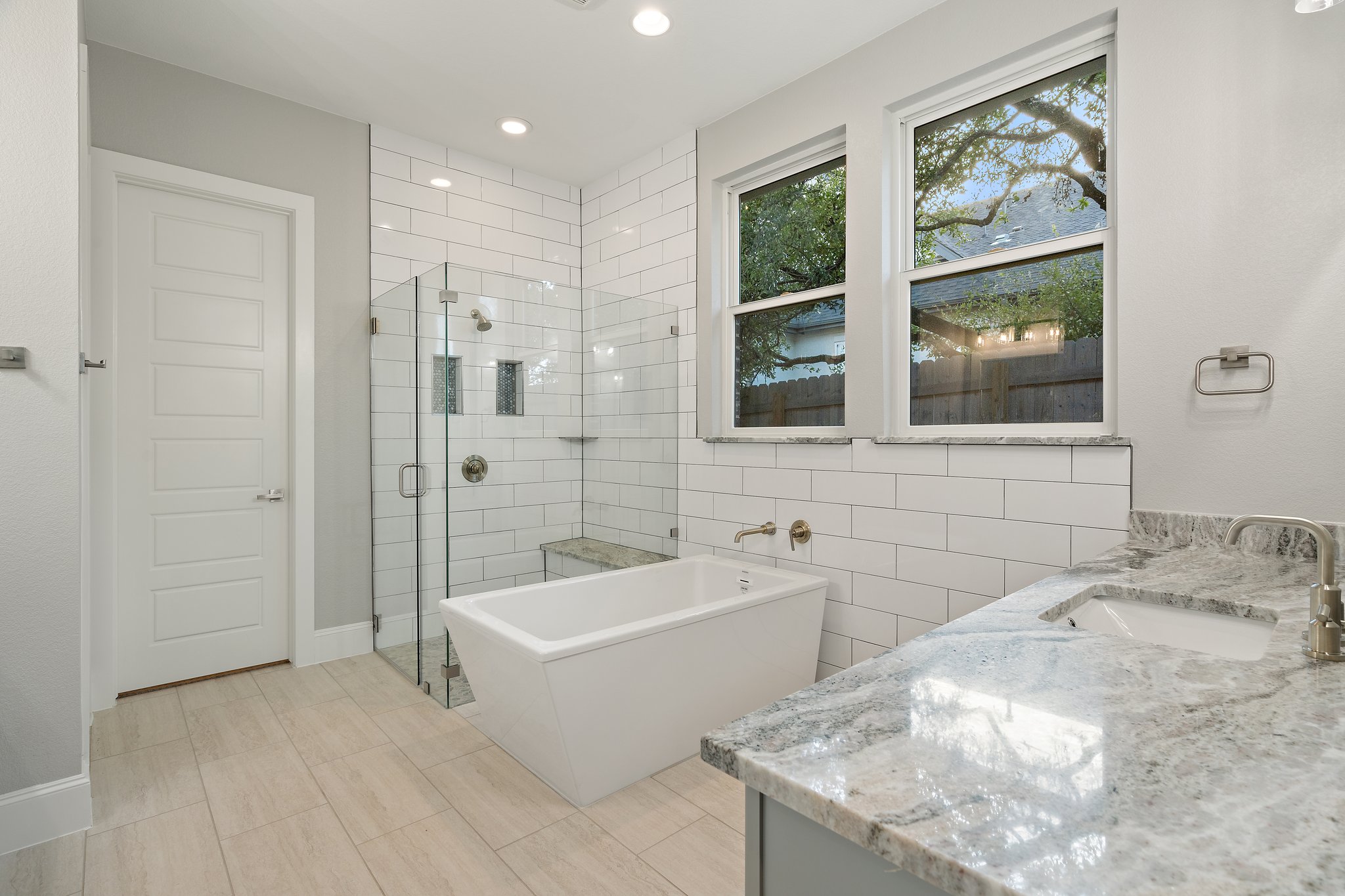 112 Axis Loop Georgetown, TX 78628 - Photo 22 of 39 a bathroom with a tub a sink and a shower