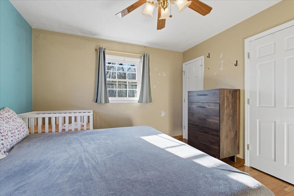 2835 Edwardsville Road Hardy, VA 24101 - Photo 11 of 35 a bedroom with a bed and wooden floor