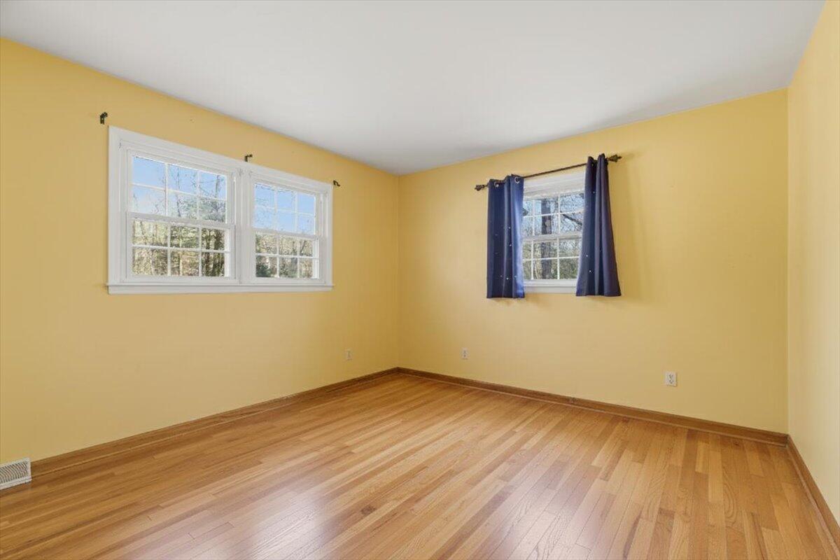 2835 Edwardsville Road Hardy, VA 24101 - Photo 13 of 35 a view of an empty room with wooden floor and a window