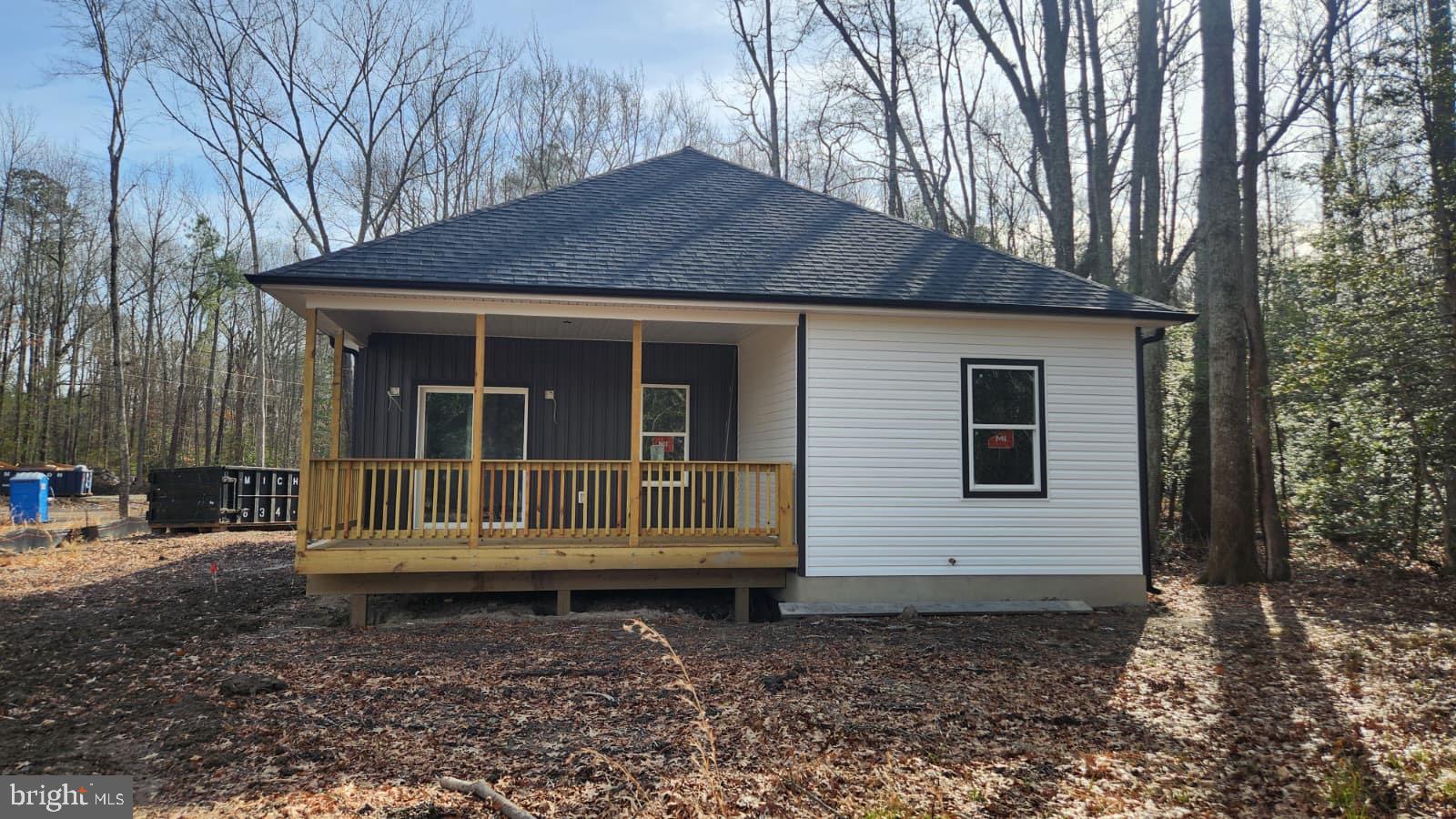 175 Rose Way Colonial Beach, VA 22443 - Photo 13 of 16 a front view of a house with a yard