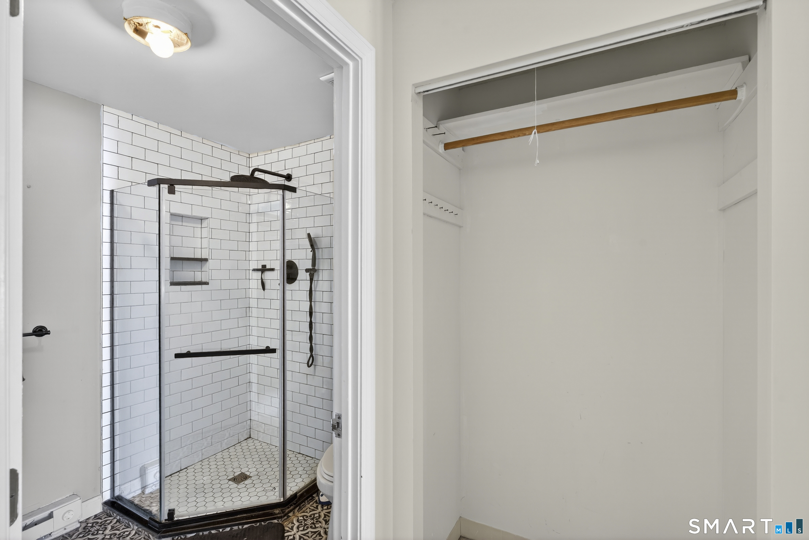 21 Putter Drive, Unit 303S Wallingford, CT 06492 - Photo 13 of 30 a bathroom with a glass shower door