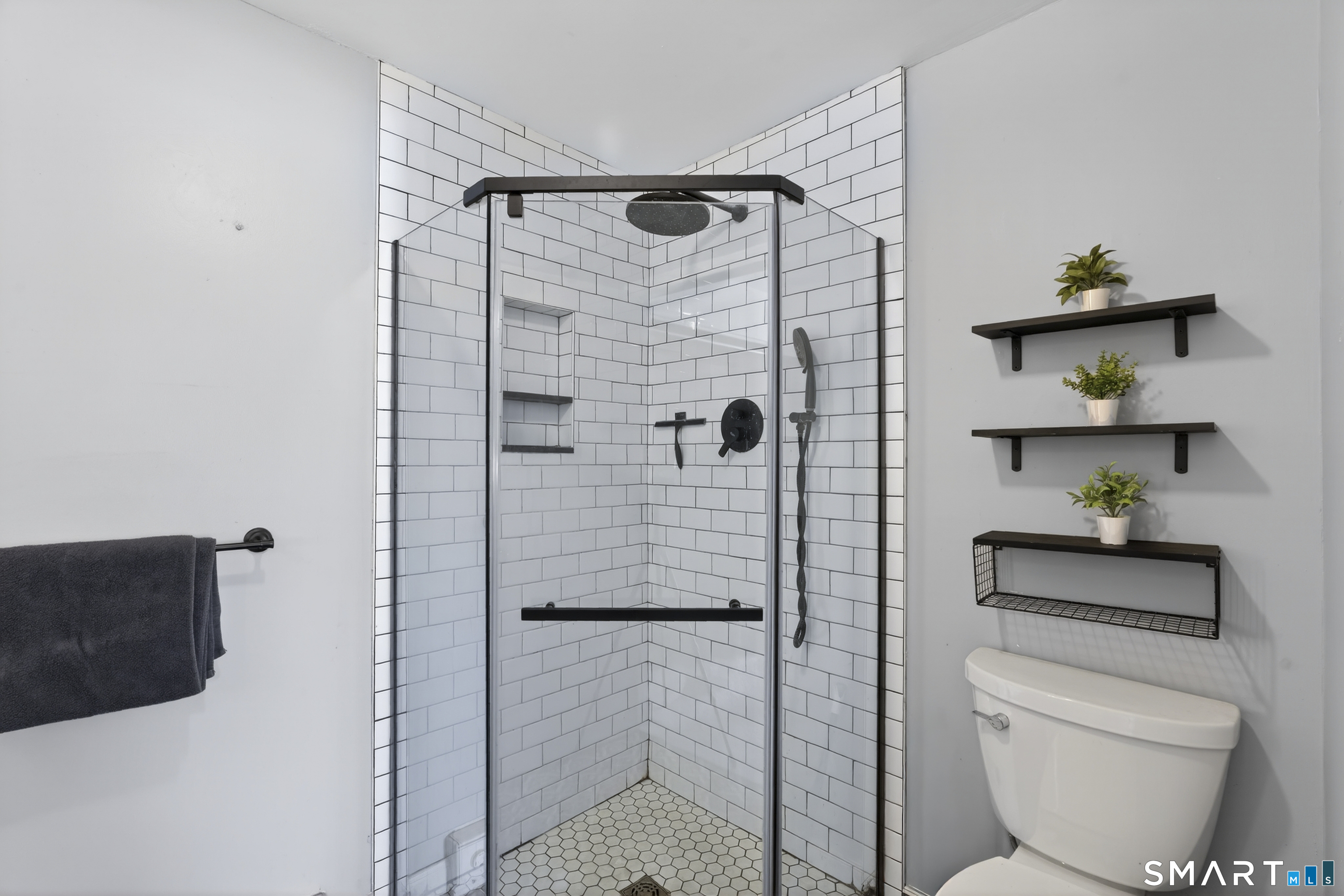 21 Putter Drive, Unit 303S Wallingford, CT 06492 - Photo 15 of 30 a bathroom with a toilet and a shower