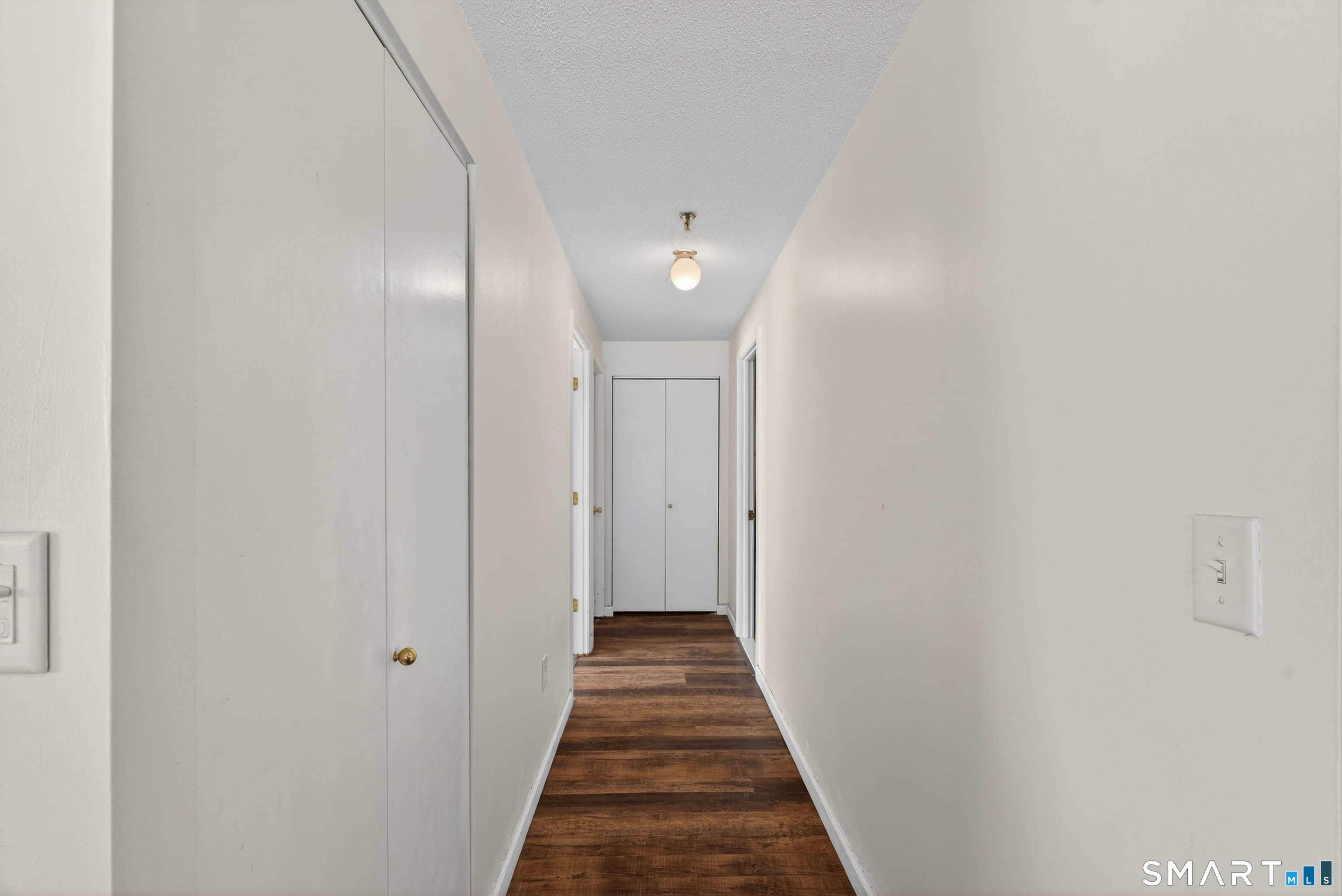 21 Putter Drive, Unit 303S Wallingford, CT 06492 - Photo 16 of 30 a view of a hallway with wooden floor