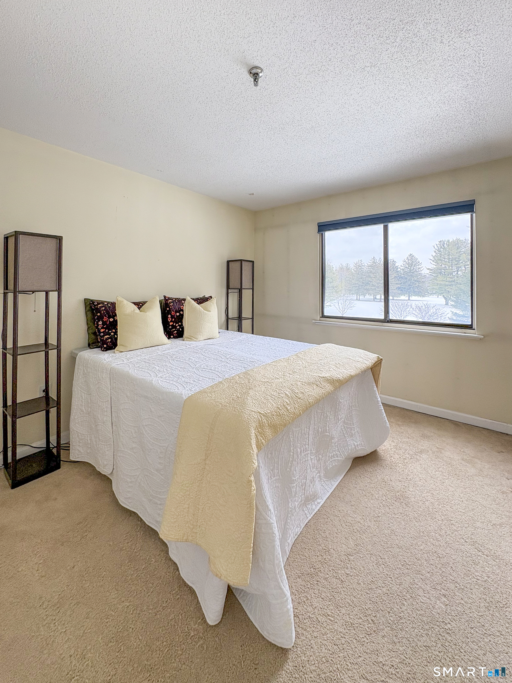 21 Putter Drive, Unit 303S Wallingford, CT 06492 - Photo 2 of 30 a spacious bedroom with a bed and a window