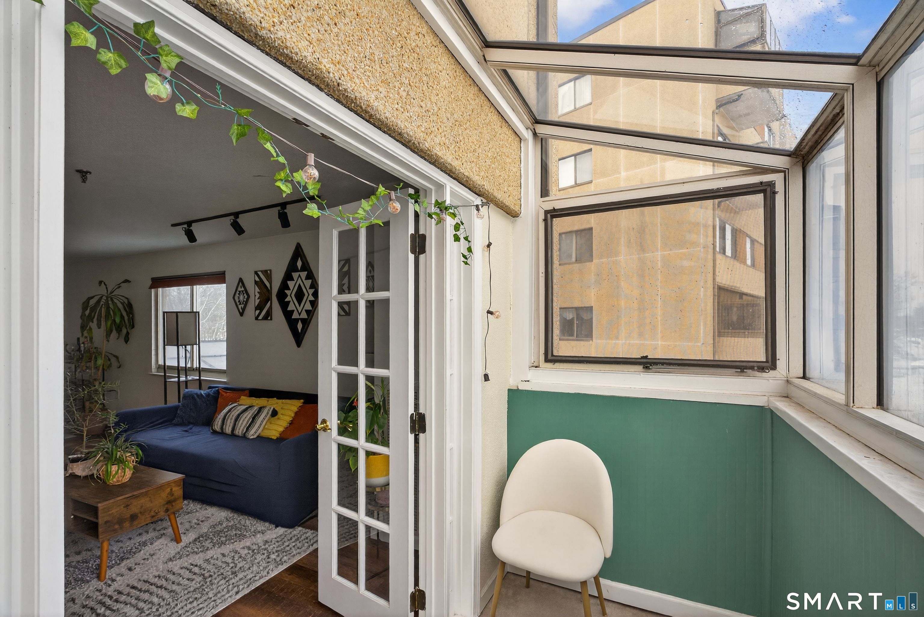 21 Putter Drive, Unit 303S Wallingford, CT 06492 - Photo 27 of 30 a living room with furniture and a window