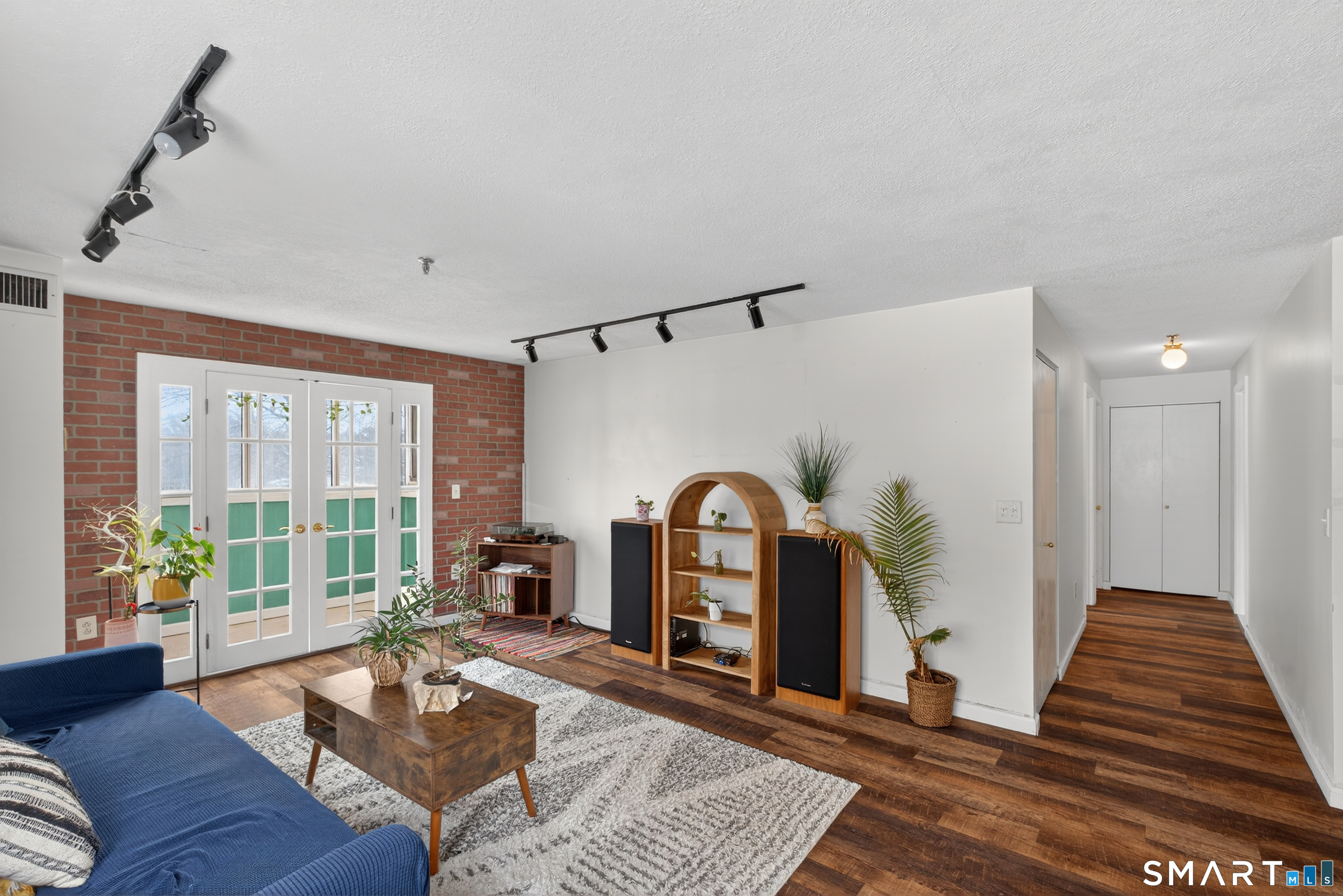 21 Putter Drive, Unit 303S Wallingford, CT 06492 - Photo 29 of 30 a living room with furniture and a fireplace
