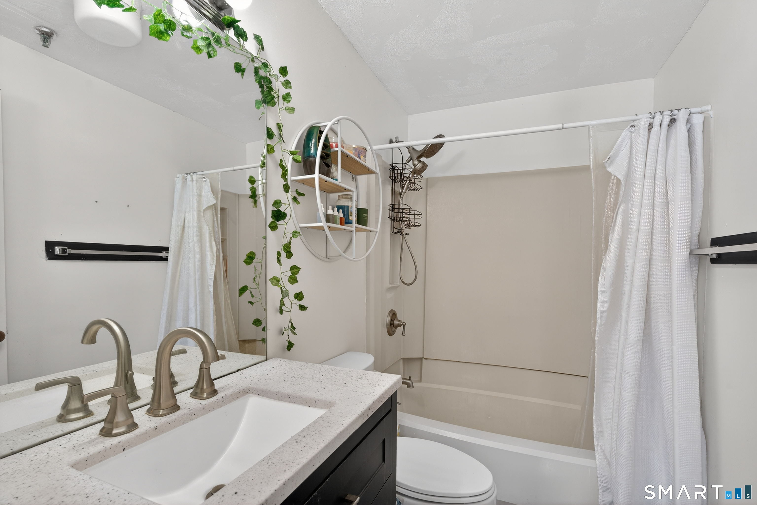 21 Putter Drive, Unit 303S Wallingford, CT 06492 - Photo 6 of 30 a bathroom with a granite countertop sink a toilet and shower