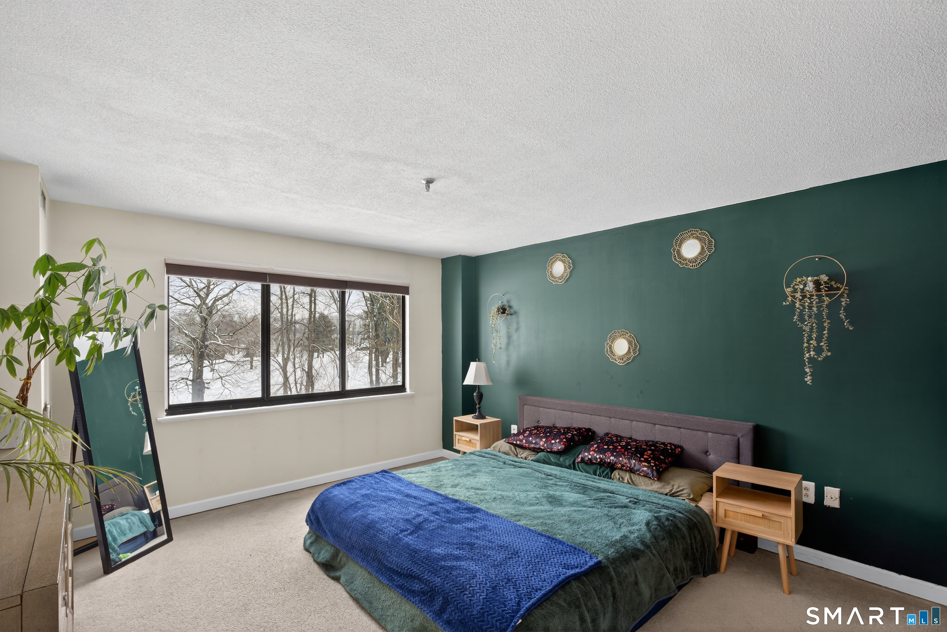 21 Putter Drive, Unit 303S Wallingford, CT 06492 - Photo 9 of 30 a bed room with a bed window and potted plant