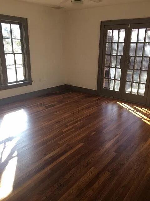 2915 21st Street Lubbock, TX 79410 - Photo 18 of 18 wooden floor in an empty room with a window