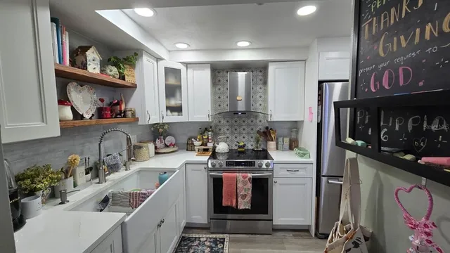 a kitchen with a sink stove and cabinets
