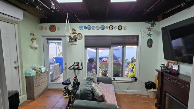 a garage with a couch and a flat screen tv