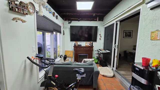 a room with furniture and a flat screen tv